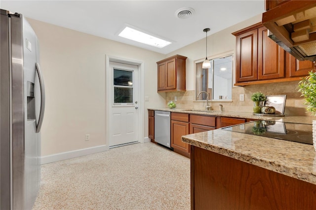 3107 Troy Dr, Orlando, FL 32806 - kitchen with tasteful backsplash, visible vents, a sink, appliances with stainless steel finishes, and under cabinet range hood