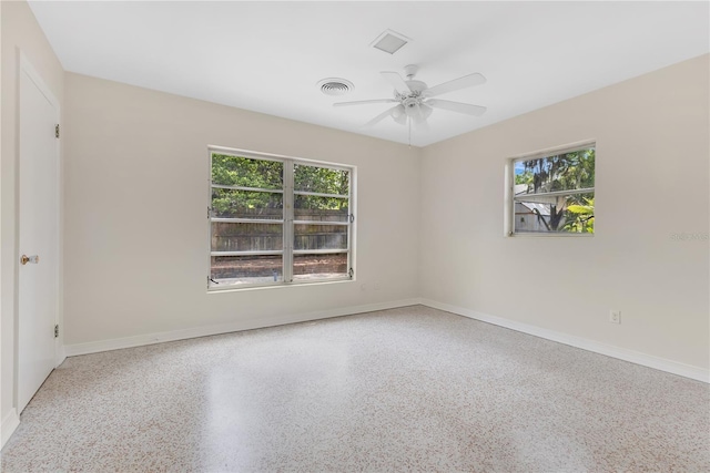 3107 Troy Dr, Orlando, FL 32806 - spare room with speckled floor, baseboards, a ceiling fan, and visible vents