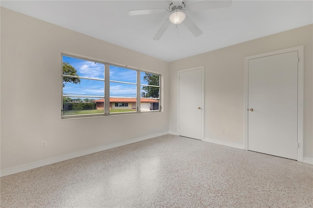 3107 Troy Dr, Orlando, FL 32806 - unfurnished bedroom featuring speckled floor, baseboards, and ceiling fan