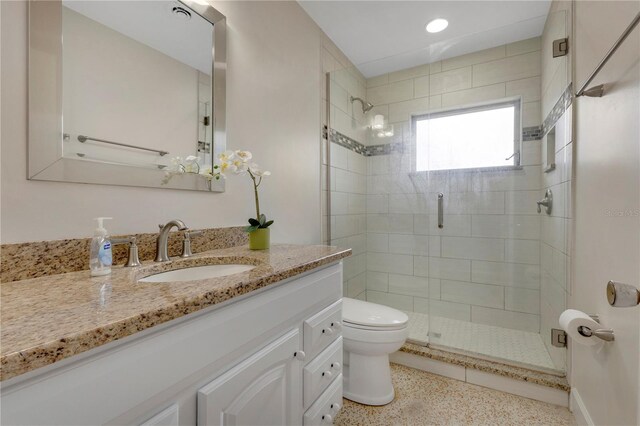3107 Troy Dr, Orlando, FL 32806 - full bathroom featuring vanity, a stall shower, speckled floor, and toilet