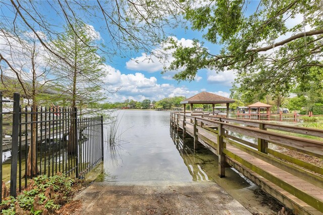3107 Troy Dr, Orlando, FL 32806 - dock area with a gazebo, fence, and a water view