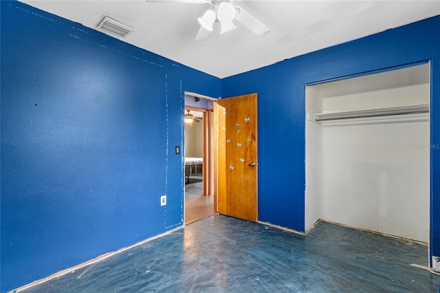 6031 W Ridgewood Ave, Orlando, FL 32835 - unfurnished bedroom with a closet, concrete floors, and ceiling fan