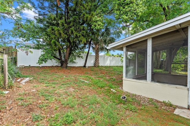 6031 W Ridgewood Ave, Orlando, FL 32835 - fenced backyard featuring a sunroom