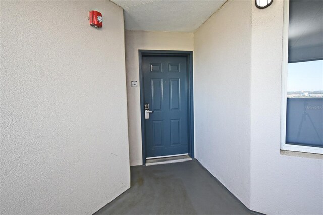 13427 Blue Heron Beach Dr Unit 1802, Orlando, FL 32821 - doorway to property with stucco siding