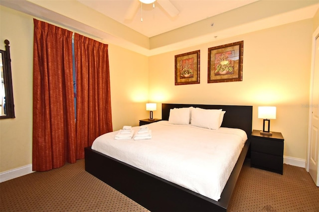 13427 Blue Heron Beach Dr Unit 1802, Orlando, FL 32821 - bedroom featuring light carpet, baseboards, and ceiling fan