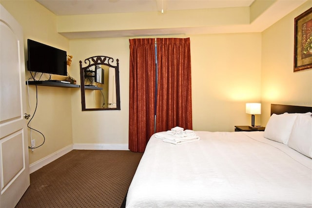 13427 Blue Heron Beach Dr Unit 1802, Orlando, FL 32821 - bedroom featuring baseboards and dark carpet