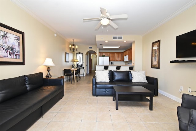 13427 Blue Heron Beach Dr Unit 1802, Orlando, FL 32821 - living area with visible vents, crown molding, arched walkways, and light tile patterned floors