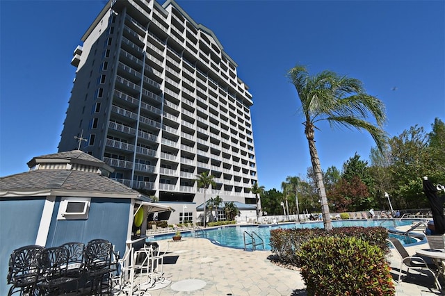 13427 Blue Heron Beach Dr Unit 1802, Orlando, FL 32821 - community pool with a patio area