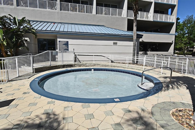 13427 Blue Heron Beach Dr Unit 1802, Orlando, FL 32821 - view of swimming pool with a jacuzzi and fence