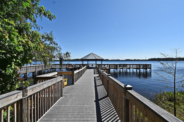 13427 Blue Heron Beach Dr Unit 1802, Orlando, FL 32821 - dock area featuring a water view and a gazebo