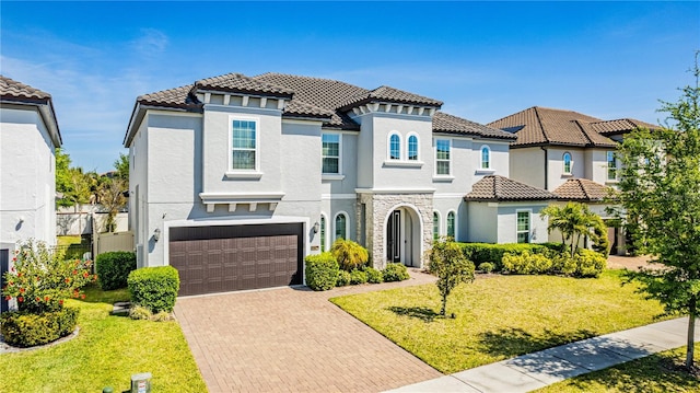 8384 Ludington Cir, Orlando, FL 32836 - mediterranean / spanish-style house featuring a tiled roof, decorative driveway, and stucco siding