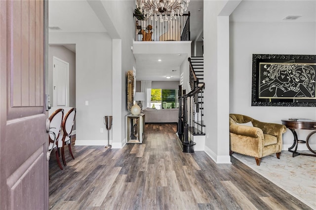 8384 Ludington Cir, Orlando, FL 32836 - entryway with baseboards, visible vents, wood finished floors, and stairway