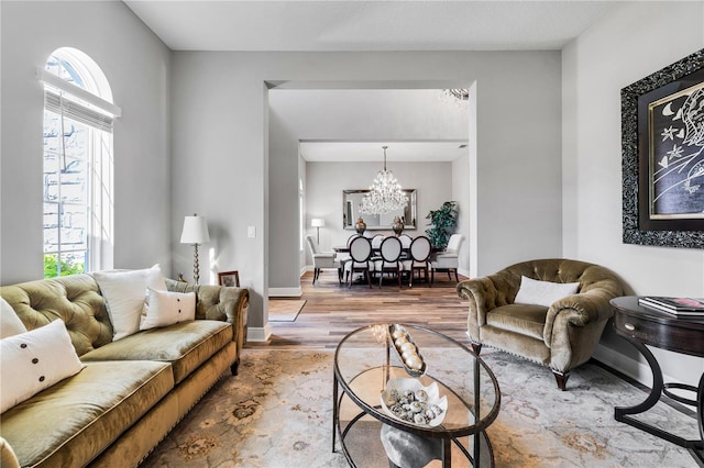 8384 Ludington Cir, Orlando, FL 32836 - living room with baseboards, a chandelier, and wood finished floors