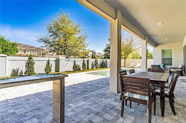 8384 Ludington Cir, Orlando, FL 32836 - view of patio featuring a fenced in pool, a fenced backyard, and outdoor dining area