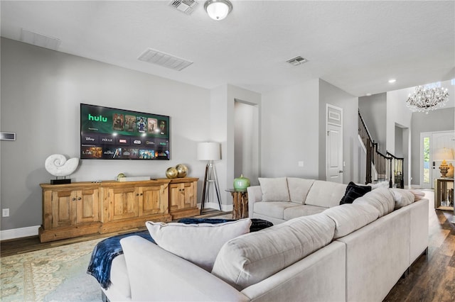 8384 Ludington Cir, Orlando, FL 32836 - living area with visible vents, stairway, and wood finished floors