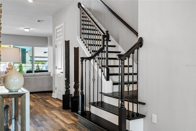 8384 Ludington Cir, Orlando, FL 32836 - staircase featuring visible vents and wood finished floors