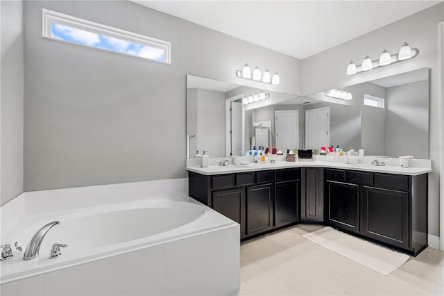 8384 Ludington Cir, Orlando, FL 32836 - bathroom featuring double vanity, a sink, and a garden tub
