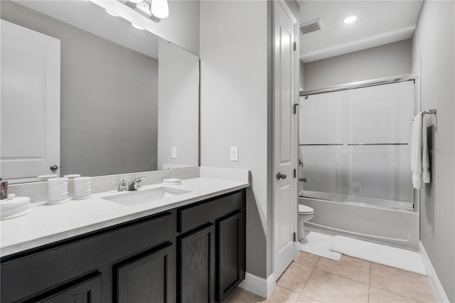 8384 Ludington Cir, Orlando, FL 32836 - bathroom with tile patterned floors, toilet, vanity, bath / shower combo with glass door, and visible vents