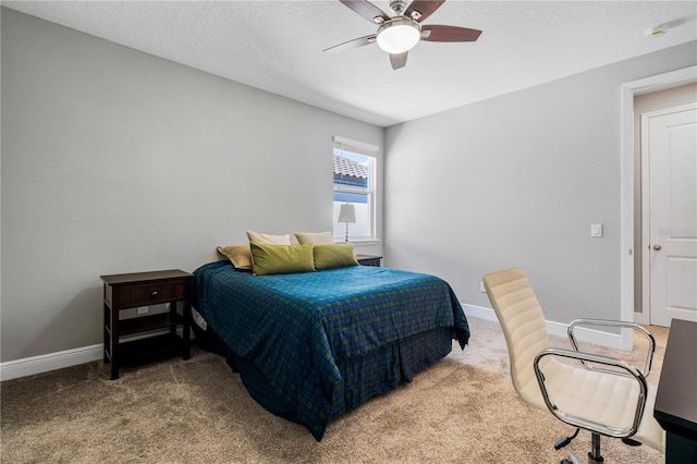 8384 Ludington Cir, Orlando, FL 32836 - carpeted bedroom with baseboards, a textured ceiling, and a ceiling fan