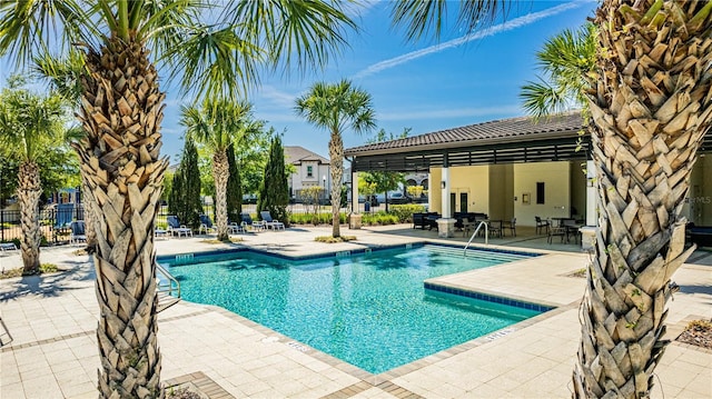 8384 Ludington Cir, Orlando, FL 32836 - community pool featuring fence and a patio