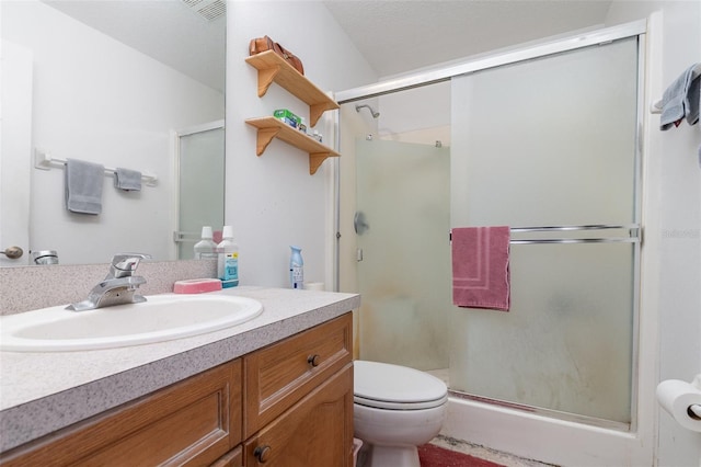 full bath featuring a shower stall, visible vents, toilet, and vanity