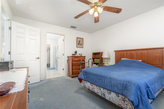 bedroom with a ceiling fan, light carpet, and visible vents