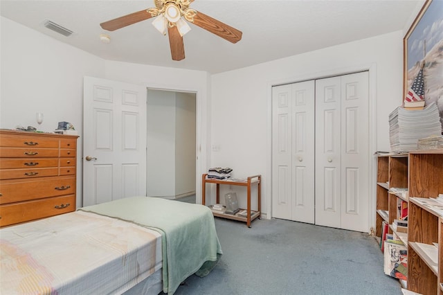 bedroom featuring a closet, carpet floors, ceiling fan, and visible vents