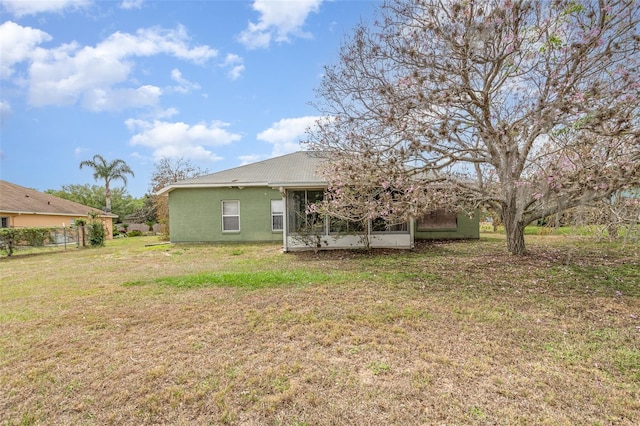 view of yard with a sunroom