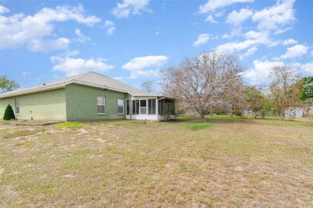 view of yard with a sunroom