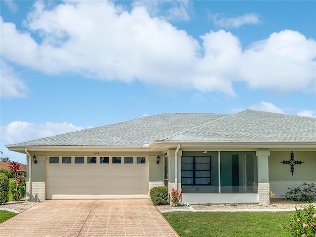 view of front of house with a garage, concrete driveway, stucco siding, and a shingled roof