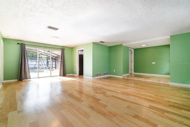 690 S Lakemont Ave, Winter Park, FL 32792 - spare room with a textured ceiling and light wood finished floors