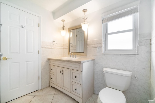 690 S Lakemont Ave, Winter Park, FL 32792 - bathroom with tile walls, vanity, tile patterned flooring, and wainscoting
