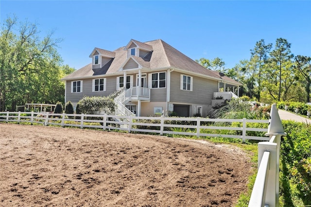 view of front of house with fence