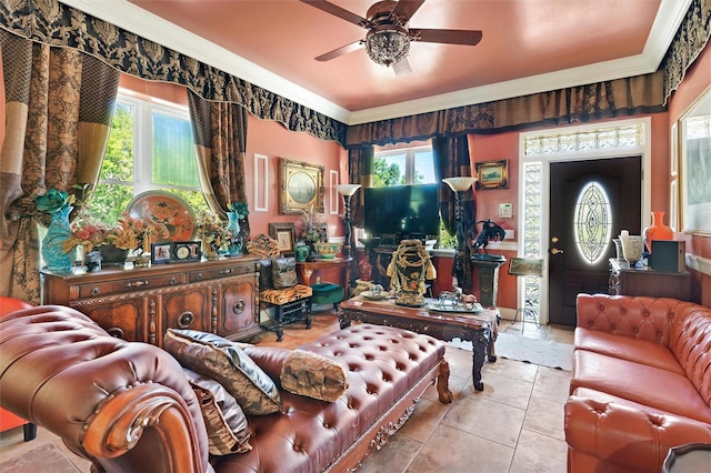 living area with a ceiling fan and ornamental molding