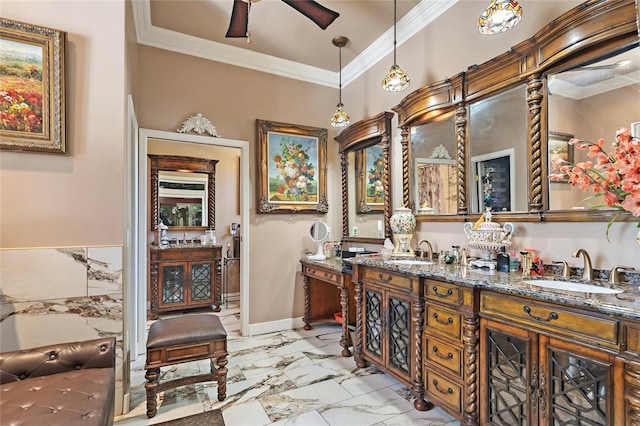 full bathroom featuring marble finish floor, double vanity, a sink, and ornamental molding