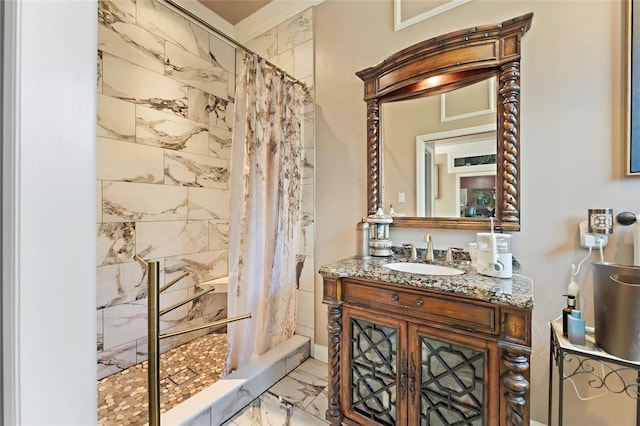 full bath with marble finish floor, ornamental molding, a shower with curtain, and vanity