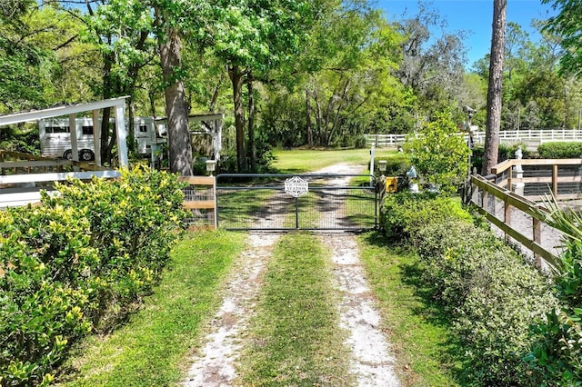 exterior space with a gated entry, a gate, and driveway