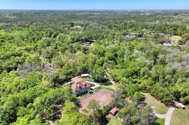 birds eye view of property featuring a wooded view