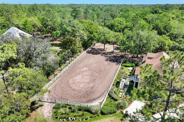 birds eye view of property with a wooded view