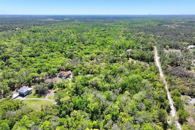 aerial view featuring a wooded view