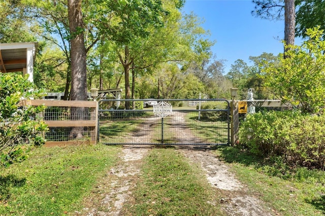 view of gate with fence