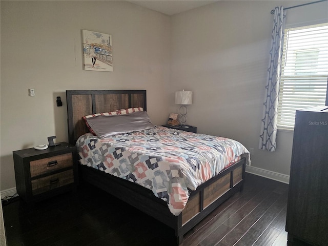 15149 Canoe Pl, Winter Garden, FL 34787 - bedroom with baseboards and dark wood finished floors