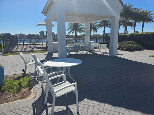 15149 Canoe Pl, Winter Garden, FL 34787 - view of patio / terrace featuring outdoor dining space and fence