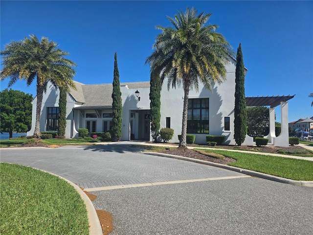15149 Canoe Pl, Winter Garden, FL 34787 - view of front of home featuring a tile roof and stucco siding