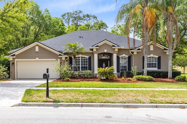 640 Brookfield Pl, Apopka, FL 32712 - single story home featuring stucco siding, roof with shingles, an attached garage, driveway, and a front yard