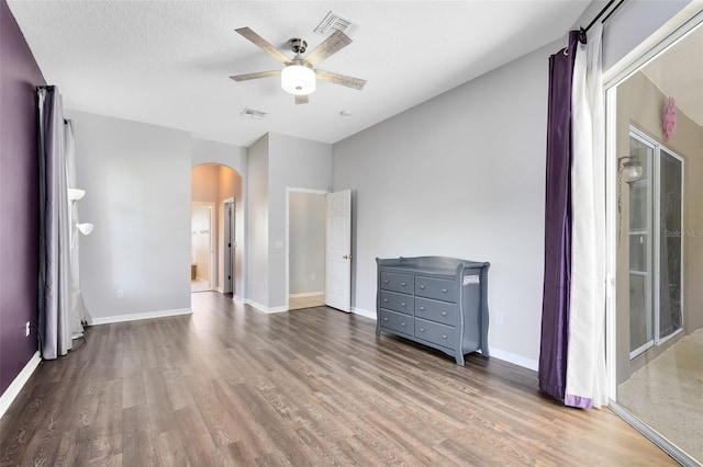 640 Brookfield Pl, Apopka, FL 32712 - unfurnished bedroom with arched walkways, visible vents, and wood finished floors
