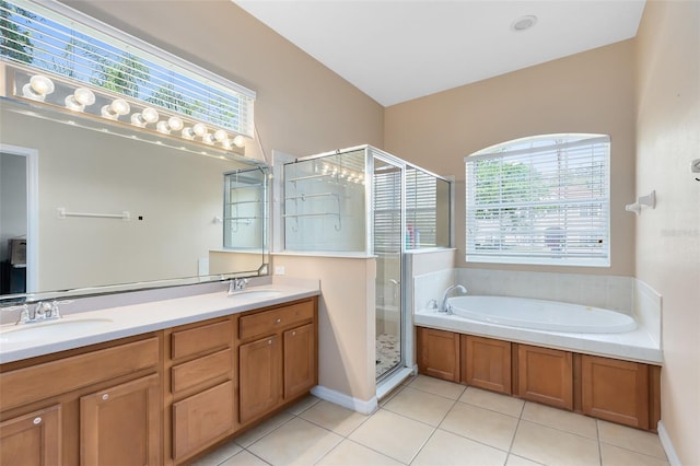 640 Brookfield Pl, Apopka, FL 32712 - bathroom featuring a stall shower, tile patterned floors, a bath, and a sink