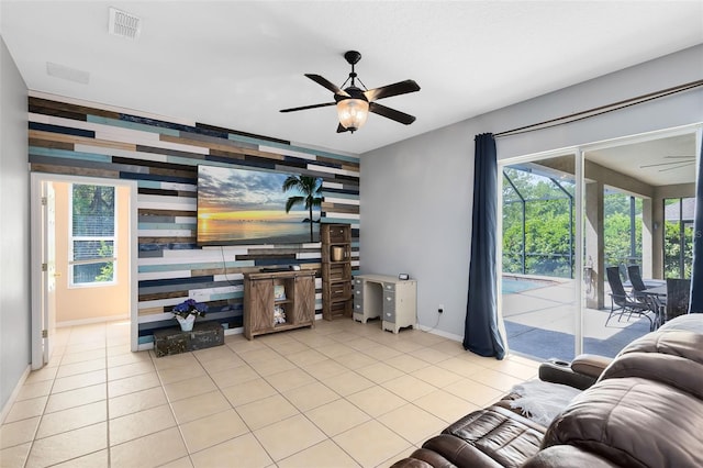 640 Brookfield Pl, Apopka, FL 32712 - tiled living room featuring baseboards, visible vents, ceiling fan, and an accent wall