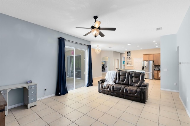 640 Brookfield Pl, Apopka, FL 32712 - living room featuring light tile patterned flooring, a ceiling fan, baseboards, visible vents, and arched walkways