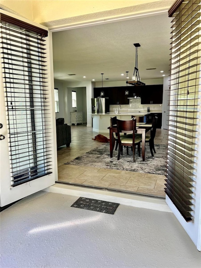 dining space featuring recessed lighting